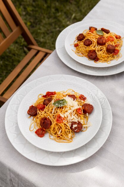 Tasty pasta with chorizo slices composition