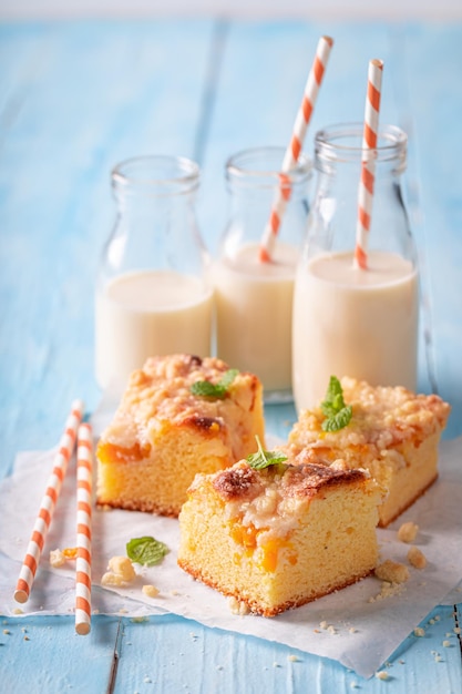 Tasty peach cake with glaze Served with milk