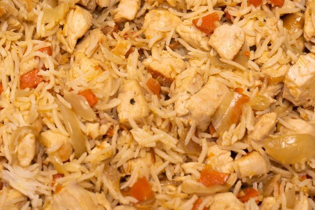 Tasty pilaf with chicken as background