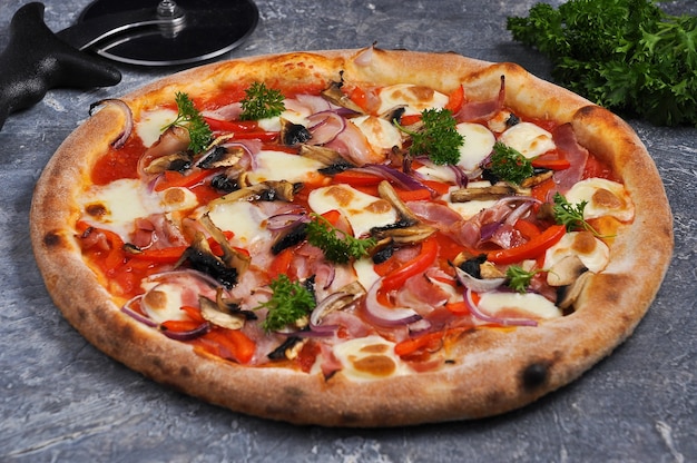 Tasty pizza with bacon sweet peppers mushrooms onions and mozzarella cheese