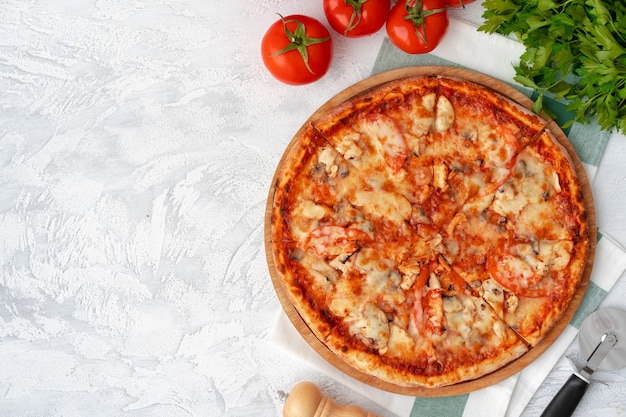 Tasty pizza with chicken and mushrooms, top view on gray table