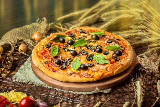 Tasty pizza with chicken vegetables and olives