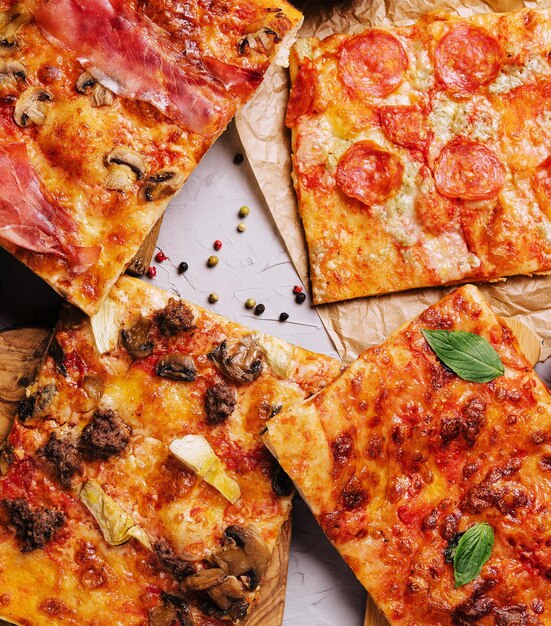 Tasty pizza on the wooden background