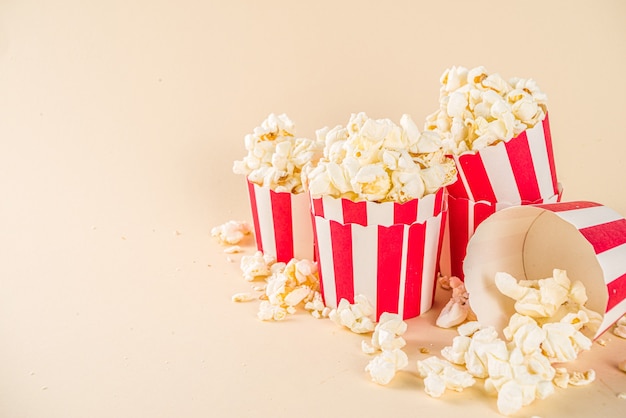 Tasty pop corn in small paper glasses