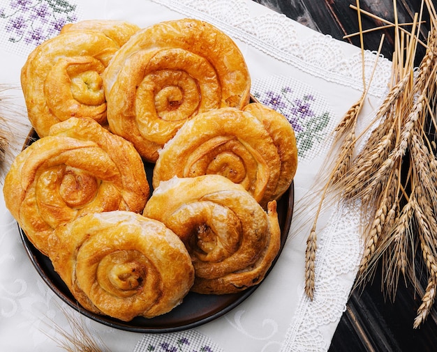 Tasty raising buns on a cloth background