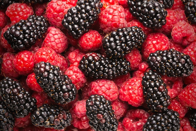 Tasty raspberry and blackberry background