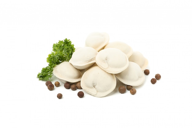 Tasty raw dumplings and spices isolated on white