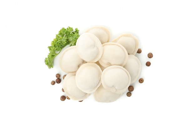 Tasty raw dumplings and spices isolated on white