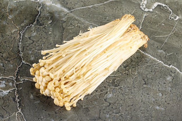 Tasty raw enoki mushroom heap for cooking