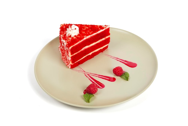 Tasty Red velvet cake in beige plate White background