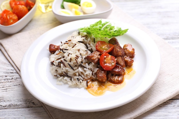 Tasty rice served on table closeup