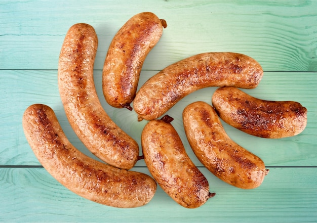 Tasty Roasted sausages on  background