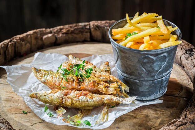 Tasty roasted smelt fish with herbs and salt