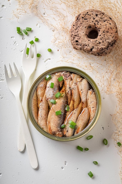 Tasty and salty smoked sprats as a mediterranean snack