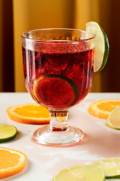 Tasty sangria with lime on table