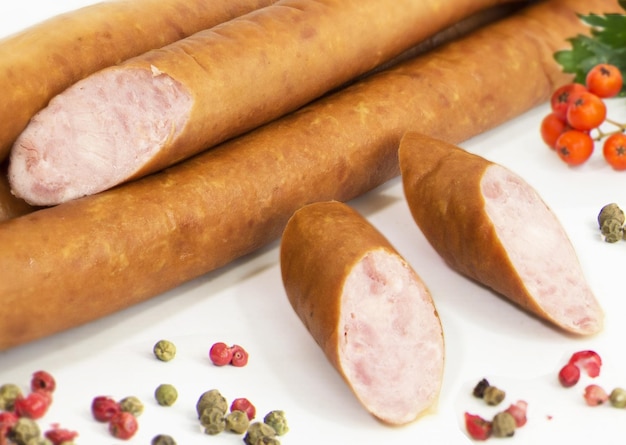 Tasty sausages isolated over white background