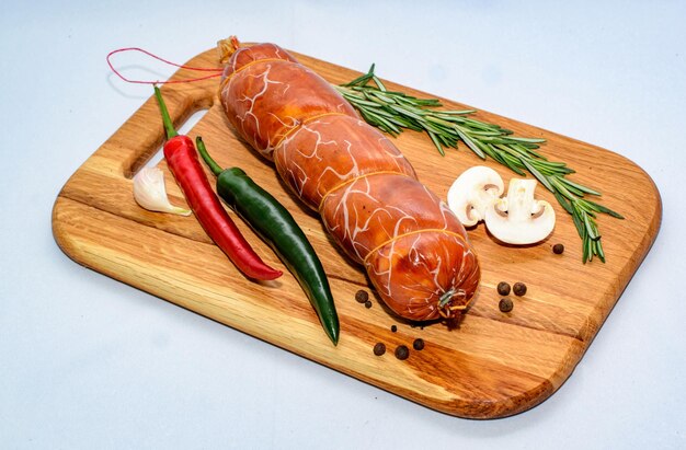 tasty sausages and vegetables isolated over solid background food photography