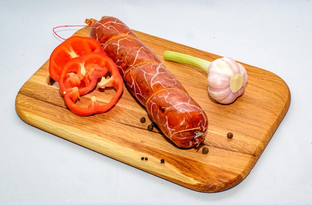 tasty sausages and vegetables isolated over solid background food photography