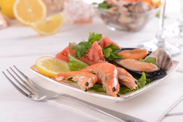 Tasty seafood on plate on table closeup