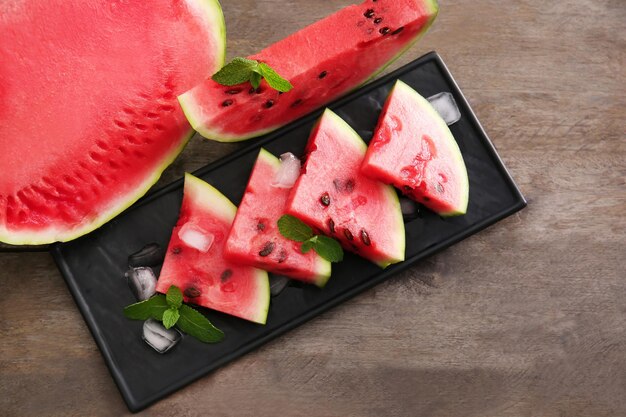 Tasty sliced watermelon on table