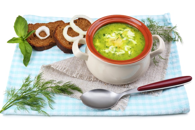 Tasty soup in saucepan isolated on white