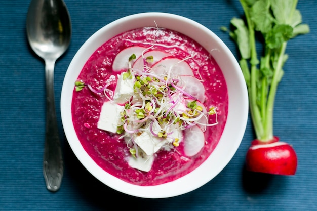 Tasty soup with radish and goat cheese