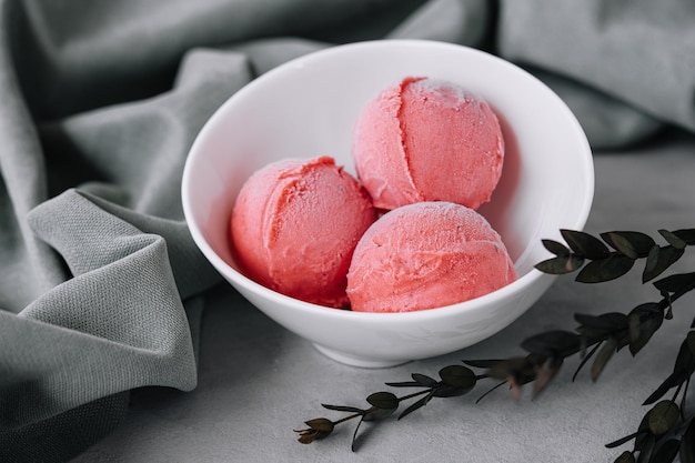 Tasty strawberry icecream balls in bowl