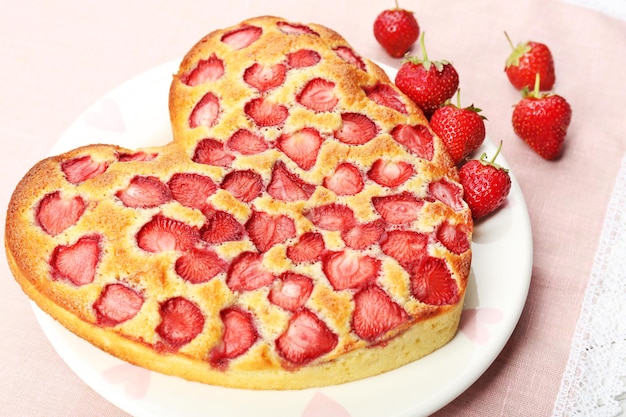 Tasty strawberry pie on table