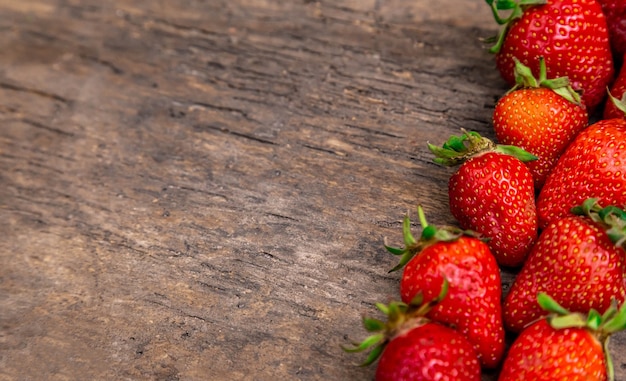 Tasty strawberry on a wooden table