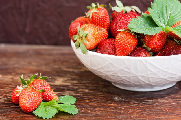 Tasty summer fruits on a wooden table.