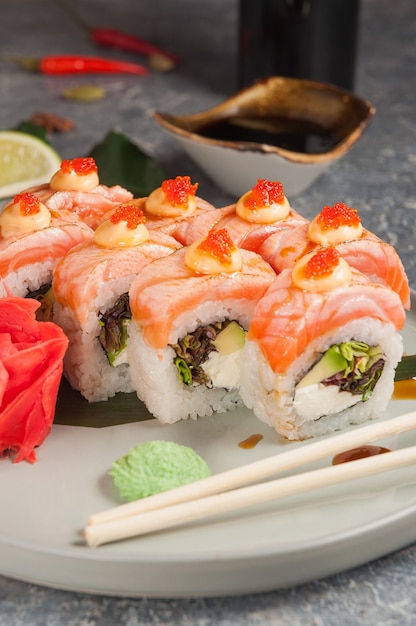 Tasty sushi rolls with salmon cream cheese and avocado