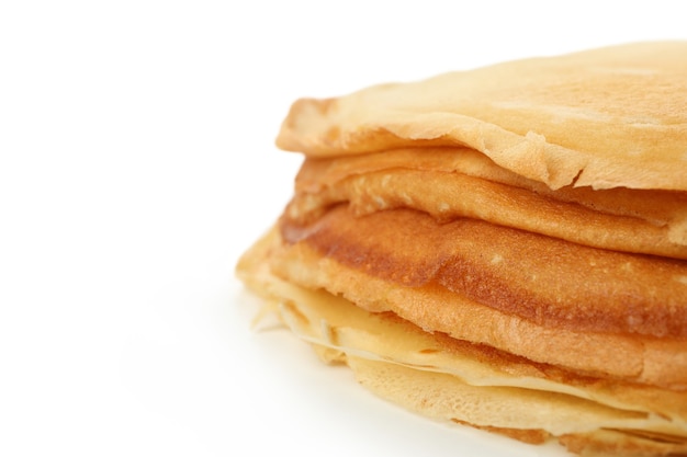 Tasty thin pancakes isolated on white background