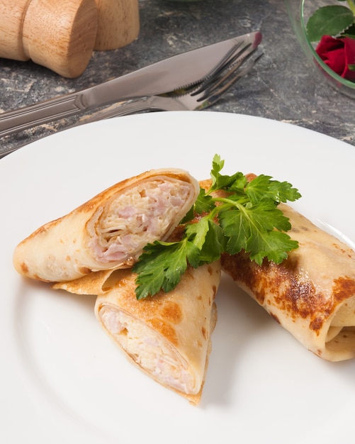 Tasty toasted Crepes with ham and cheese
