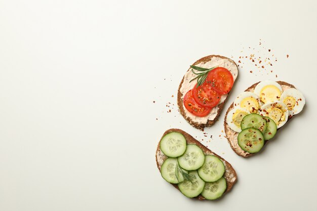 Tasty toasts with different topping isolated