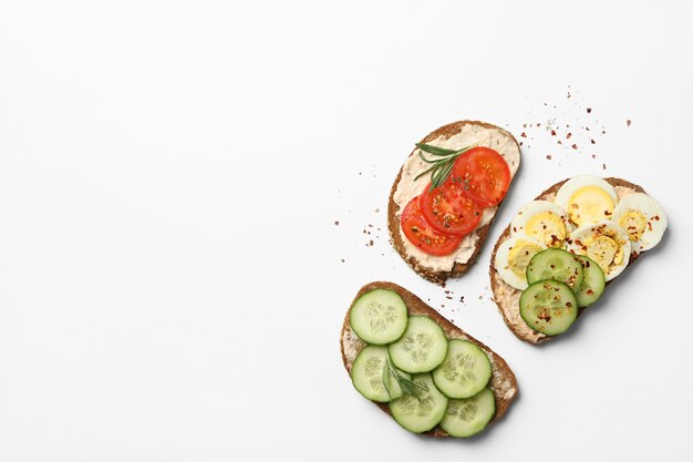 Tasty toasts with different topping isolated