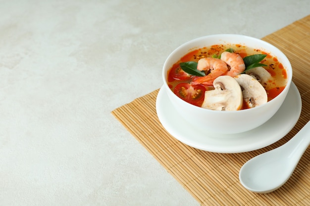 Tasty tom yum soup on bamboo mat