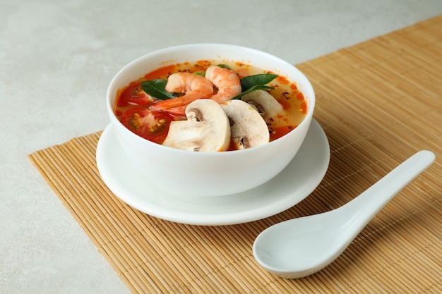 Tasty Tom yum soup on bamboo mat