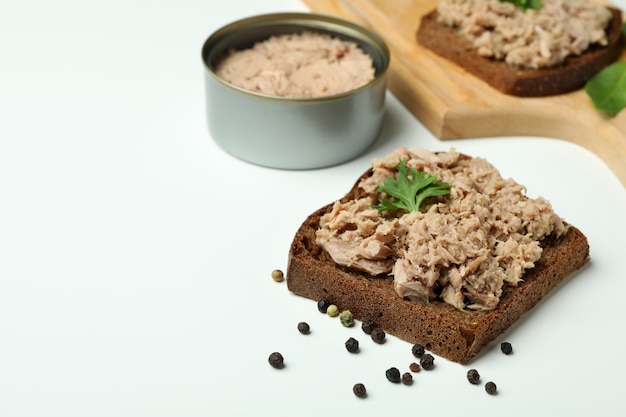 Tasty tuna sandwiches on white background, space for text