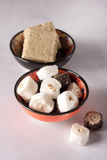 Tasty Turkish Delight on Colored Bowls Gray Background Vertical Lokum and Halva