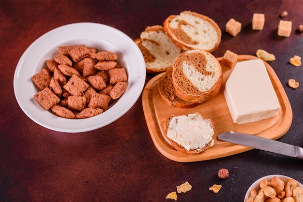 Tasty and useful breakfast with flakes, milk, nuts and dried fruits