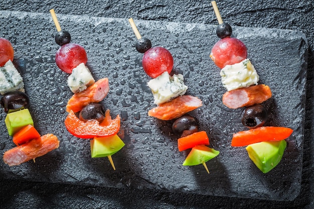 Tasty various cold snacks with vegetables and herbs for snack