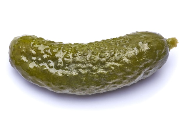 Tasty whole green cornichon isolated on a white background