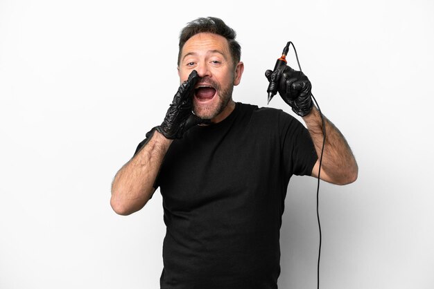 tattoo artist middle age man isolated on white background shouting with mouth wide open