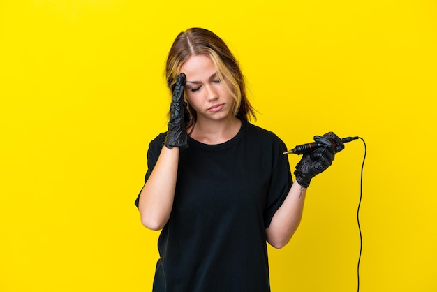 Tattoo artist Russian woman isolated on yellow background with headache