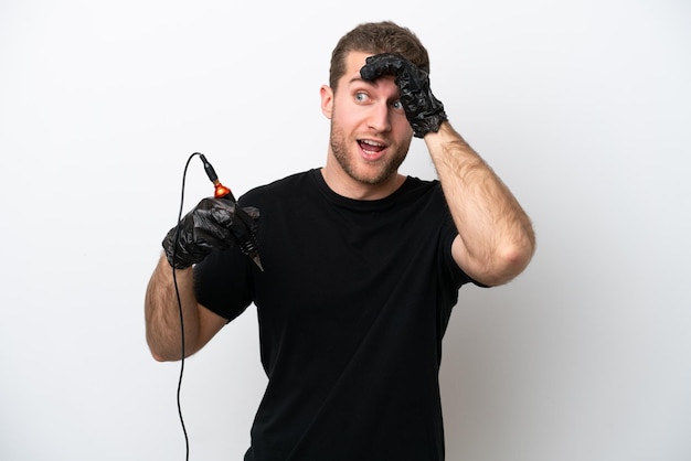 Tattoo caucasian artist man isolated on white background doing surprise gesture while looking to the side