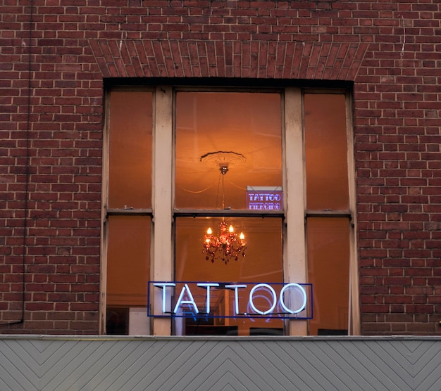 Photo tattoo studio neon sign