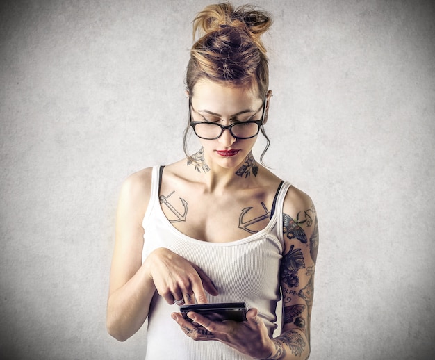 Tattooed girl calculating