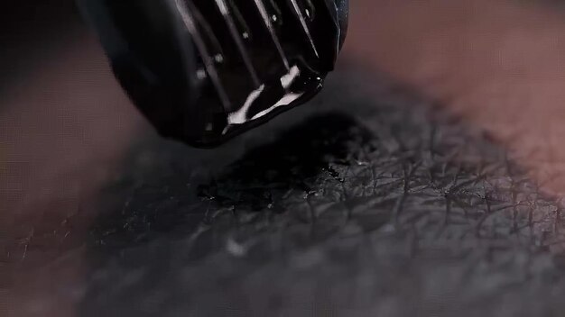 Photo tattooing close up in 4k slow motion