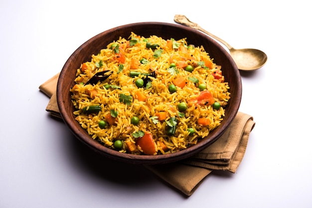 Tawa Pulao or Pulav or Pilaf or Pilau is an Indian Street Food  made using basmati rice, vegetables and spices. Selective focus