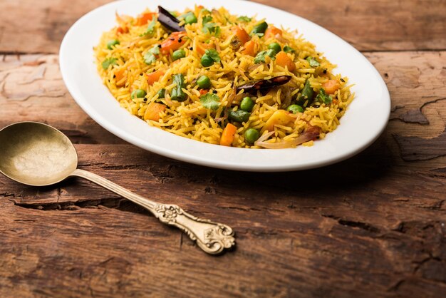 Tawa Pulao or Pulav or Pilaf or Pilau is an Indian Street Food  made using basmati rice, vegetables and spices. Selective focus